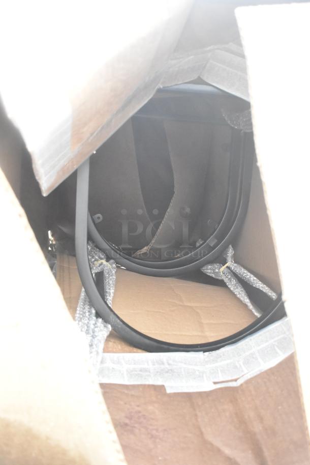 Cardboard box containing new, unpacked items including an ice bin and shelves, partially visible and slightly dented.