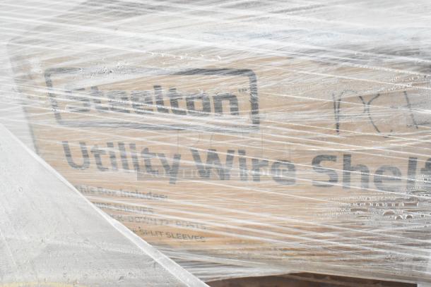 Sealed package labeled "Utility Wire Shelf" under plastic wrap, indicating included items for auction.