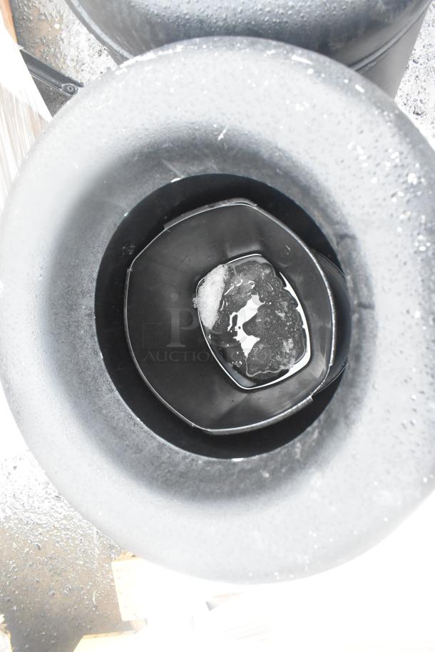 Brand new trash can shells, including 2 black poly and 1 wood pattern, scratch and dent condition.