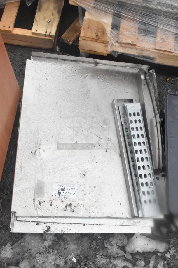 Seven assorted metal items, including perforated and flat sheets, in used condition, placed on pallets. Visible label reads "360 3/Qty Afpx."