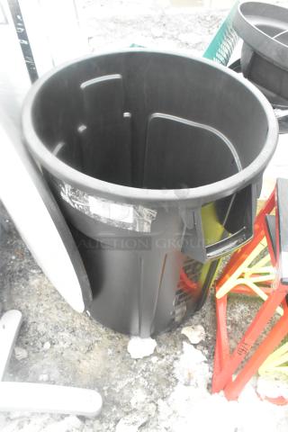 Rubbermaid black poly trash can, durable construction. Appears in good condition. Features easy-grip handles and label area.