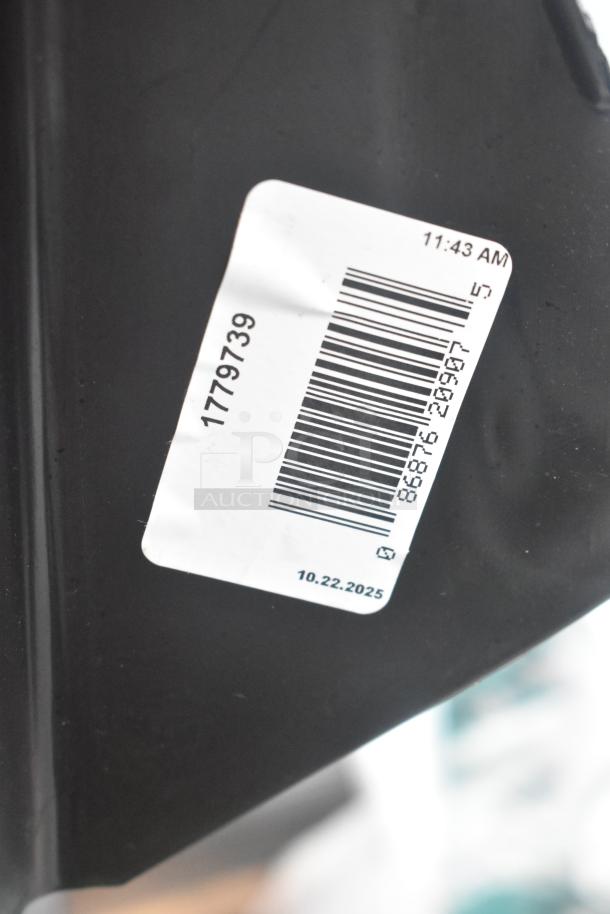 Rubbermaid Black Poly Trash Can with barcode label, indicating item number 1779739 and date 10.22.2025.