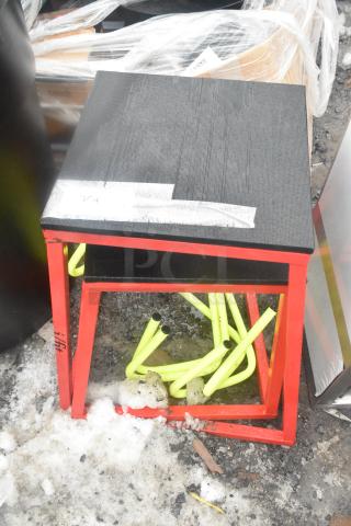 Forza red and black stool set with square seats, modern design. Features a durable black top and red metal frame.