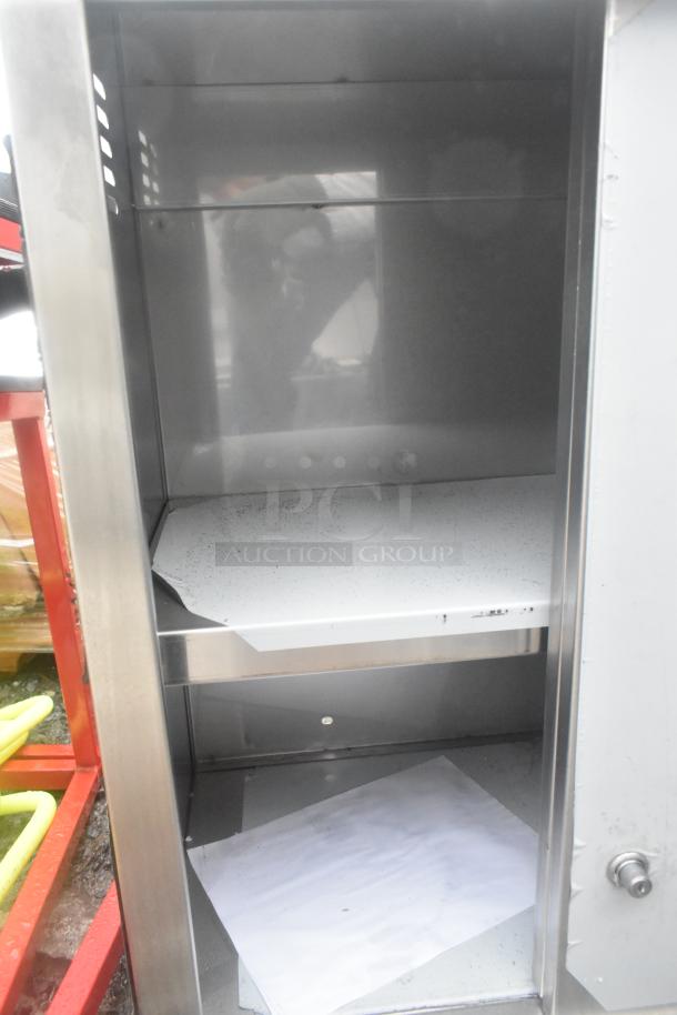 Regency 600WCS1524 24" stainless steel wall cabinet with sliding doors. Brand new with visible scratches and dents.