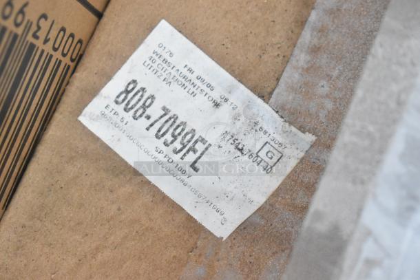 Label on cardboard with SKU 808-7099FL for WebstaurantStore item, showing minor wear.