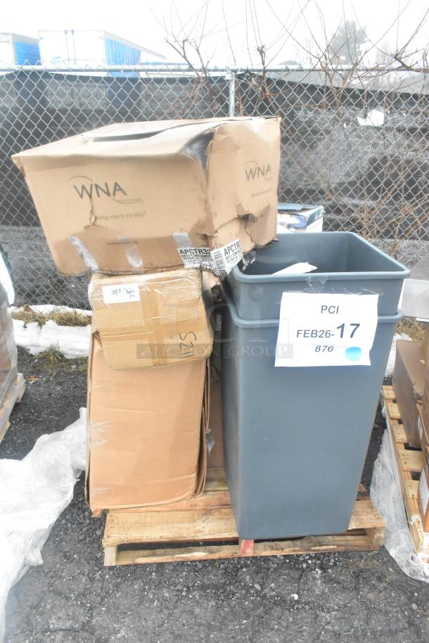 13 scratch and dent items on a pallet including trash cans, visible WNA-branded boxes, some boxes damaged.