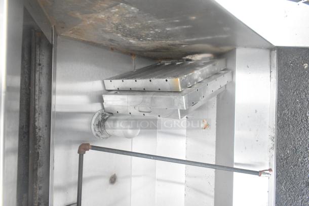 5' commercial grease hood with integrated lights, stainless steel, used condition, visible surface wear, suitable for kitchen use.