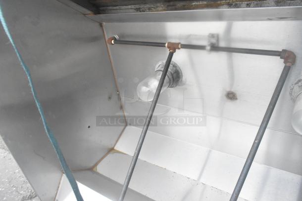 5' commercial grease hood with lights, featuring a sturdy metal structure and visible wiring. Good condition.