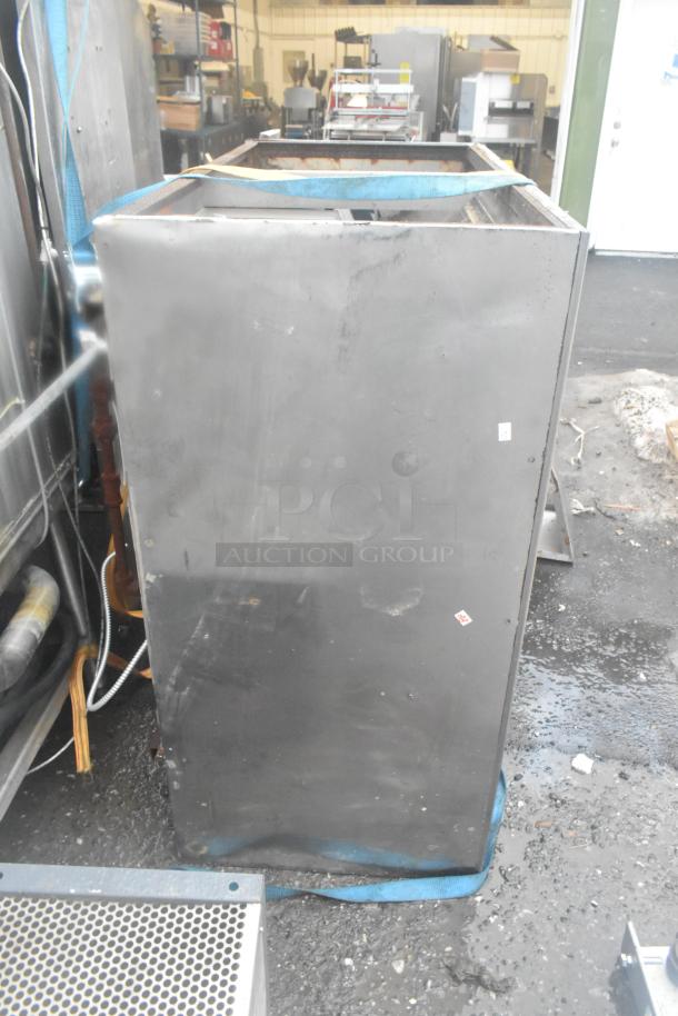 5' commercial grease hood with lights, stainless steel, visible wear, outdoor setting, installed straps indicating use.
