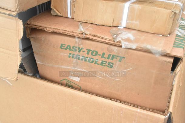 Cardboard boxes labeled "EASY-TO-LIFT HANDLES" contain 15 brand new scratch and dent items, including microwave shelves and table base pieces.