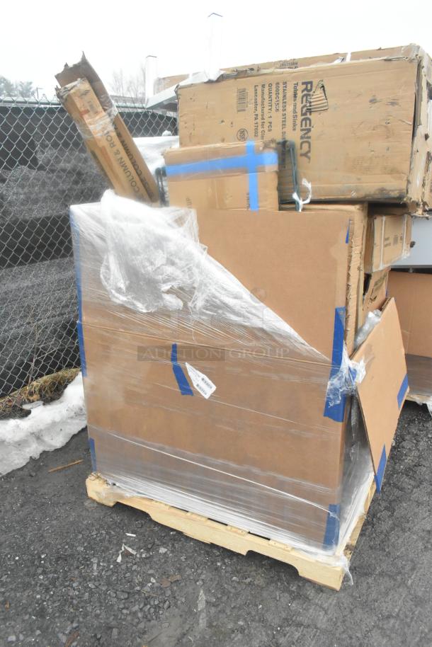 Pallet with boxed Regency stainless steel tables, shelf, and rack, new with scratches and dents, wrapped in plastic.