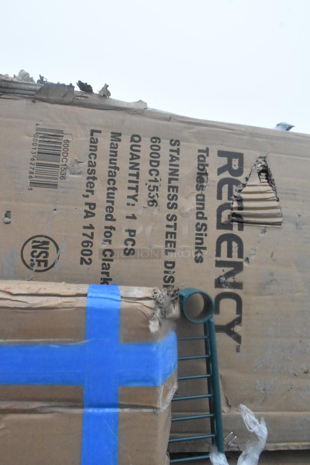 12 scratch and dent items, including work tables, shelf, dunnage rack. Regency packaging with visible minor damage.