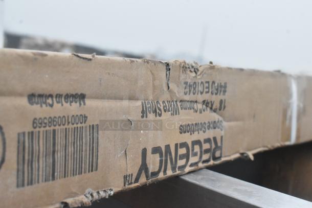 Cardboard packaging with visible dents, labeled Regency 18"x42" Chrome Wire Shelf, Scratch and Dent. Made in China.