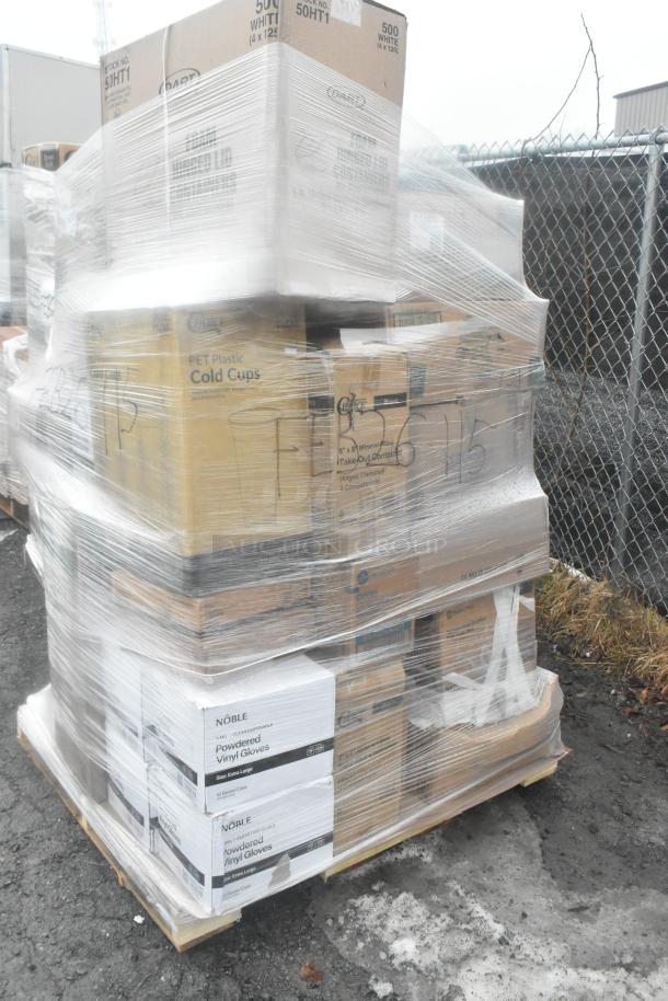 Shrink-wrapped pallet with boxes of Dart PET cold cups, takeout containers, vinyl gloves, and more. Scratch and dent condition.