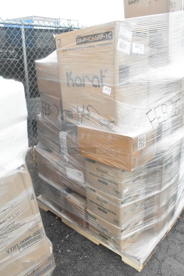 Pallet of 32 assorted brand new items, scratch and dent; includes Karat food bags, cold cups, towel rolls, take-out containers.