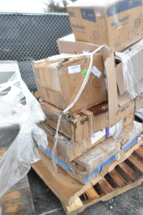 Nine brand new scratch and dent items including grease trap and floor troughs on a wooden pallet, in original packaging.