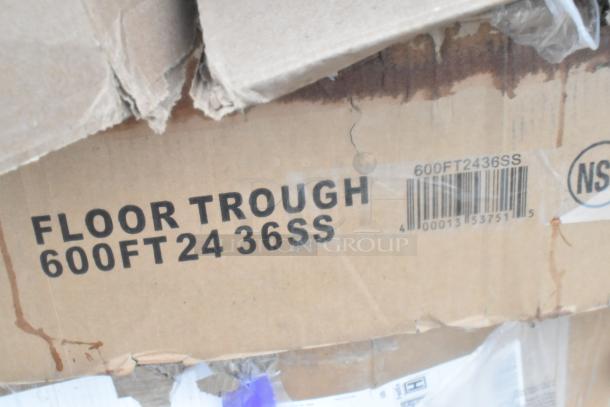Cardboard box labeled "Floor Trough 600FT24 36SS," indicating new scratch and dent items, including grease trap.