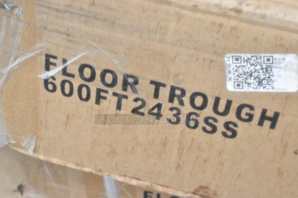 Cardboard box labeled "FLOOR TROUGH 600FT2436SS," indicating new scratch and dent auction items, including floor troughs and grease trap.
