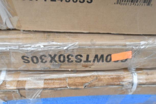 Cardboard boxes with labels "WT530X3S" and "SCRT-4836S," visibly sealed in plastic wrap.