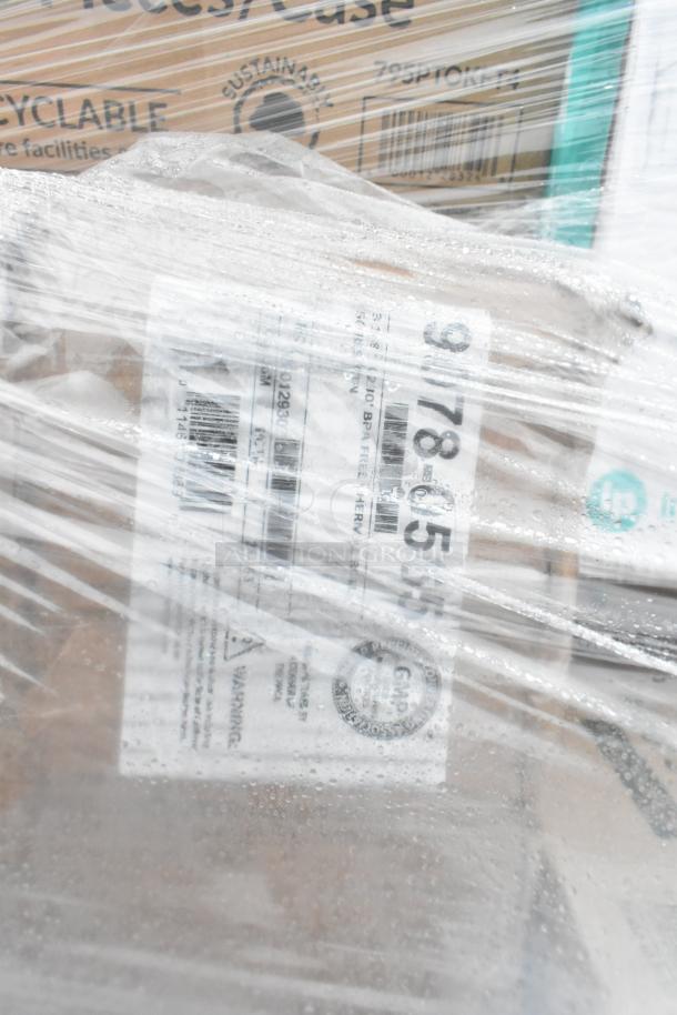 Plastic-wrapped pallet of scratch and dent items, including towels and portion cups. Labels indicate shipping info and product IDs.