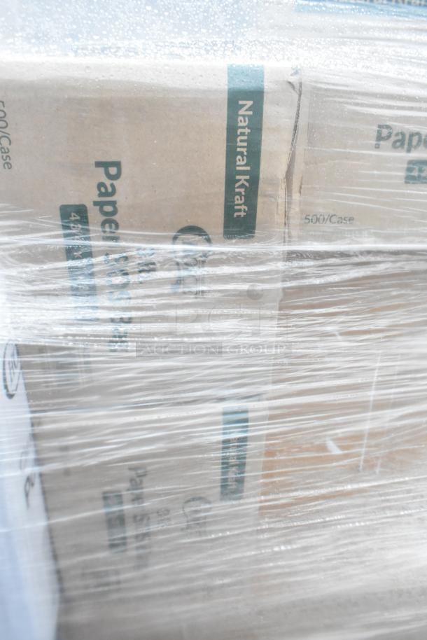 Plastic-wrapped boxes labeled "Natural Kraft" indicating 500 items per case. Part of 28 new scratch and dent items auction.