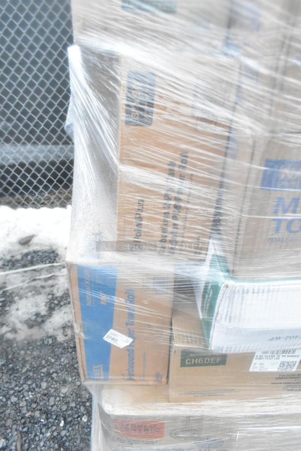 Plastic-wrapped pallet of various boxed items, including towels and portion cups, some with visible labels. 28 items in total.