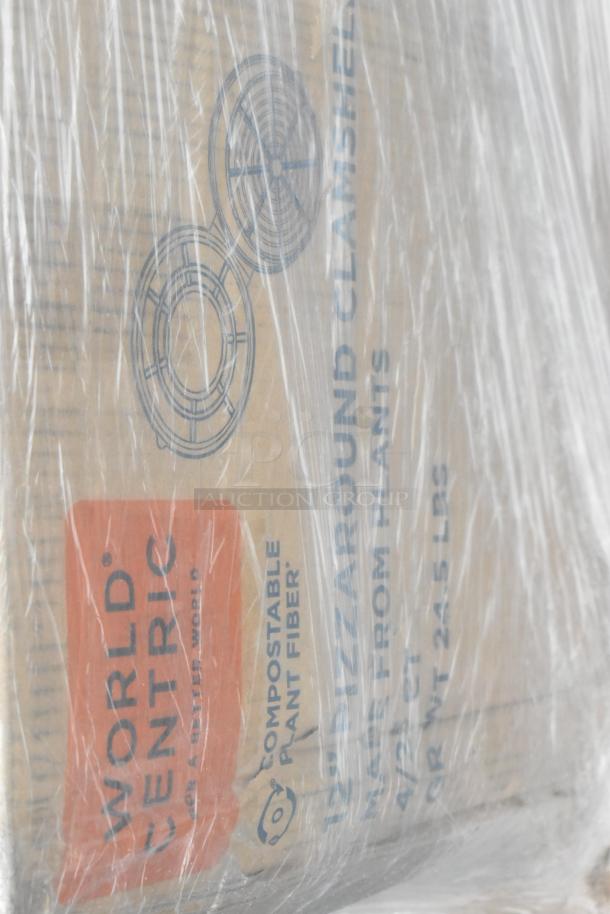 Box of World Centric compostable fiber items, wrapped in plastic. Includes 28 scratch and dent items like towels and cups.