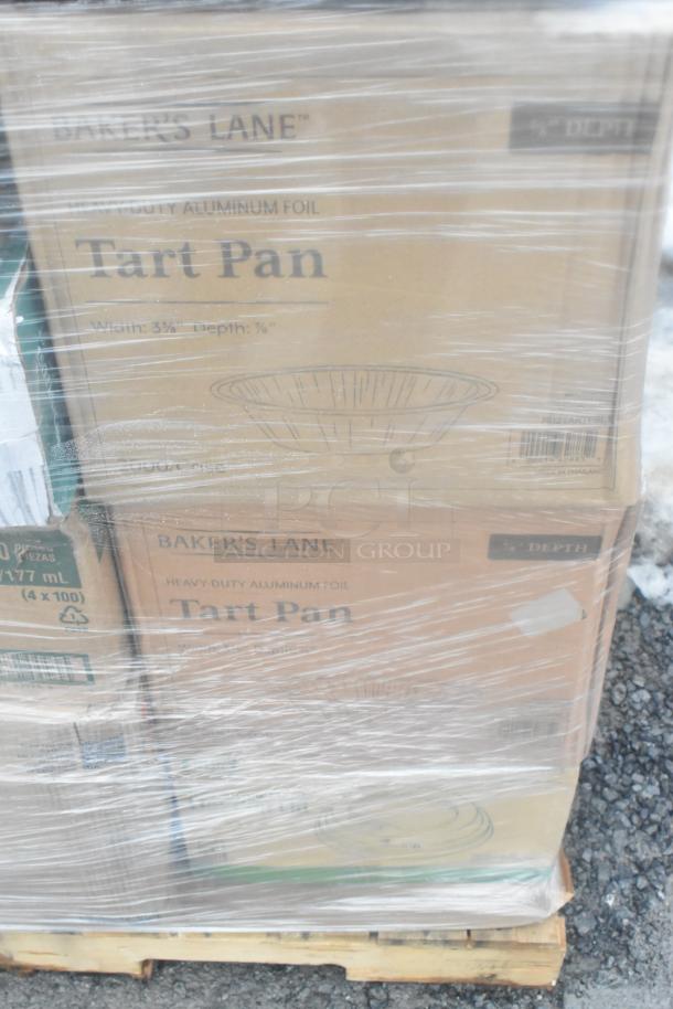 Pallet of Baker's Lane tart pan boxes, plastic-wrapped, indicating items are brand new, some with scratch and dent condition.