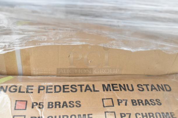 Cardboard box labeled "Single Pedestal Menu Stand," slightly damaged, wrapped in clear plastic. Items include ice bin, dish table.