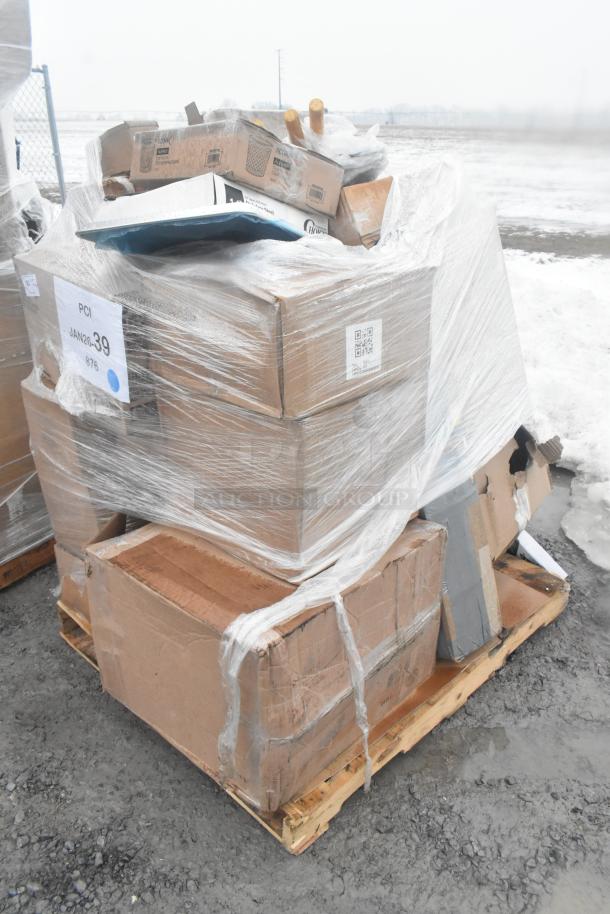 Pallet of 20 scratch and dent items, including dolly, sieve, paper cutter, and glasses. Wrapped in plastic with visible labels.