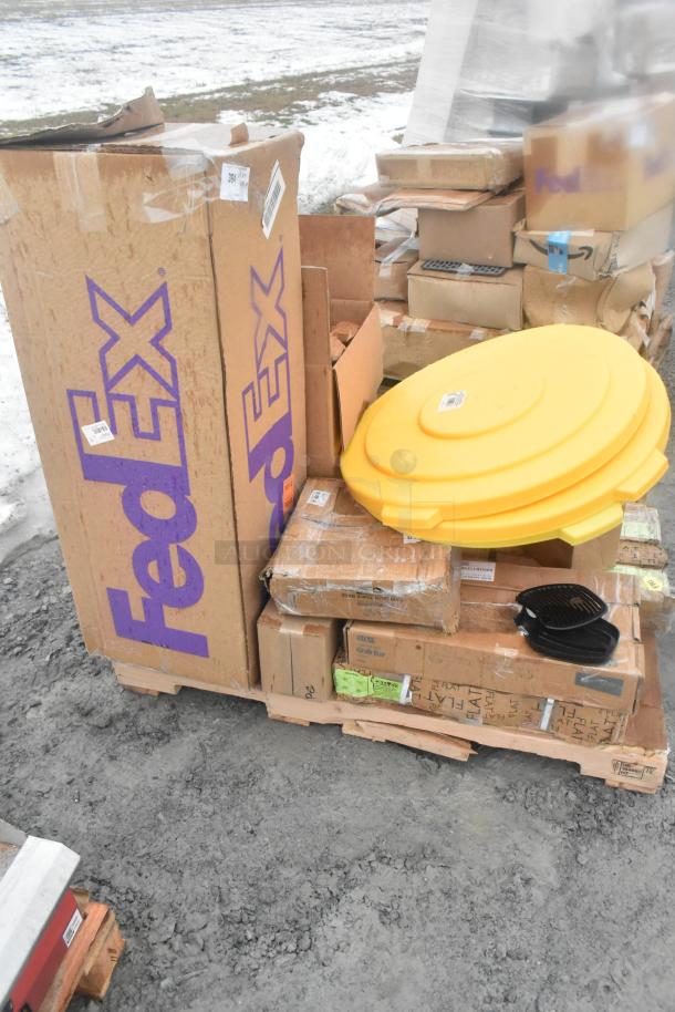 Stack of scratch and dent boxes including oven rack, storage rack, take out containers, and roaster pan on a pallet.