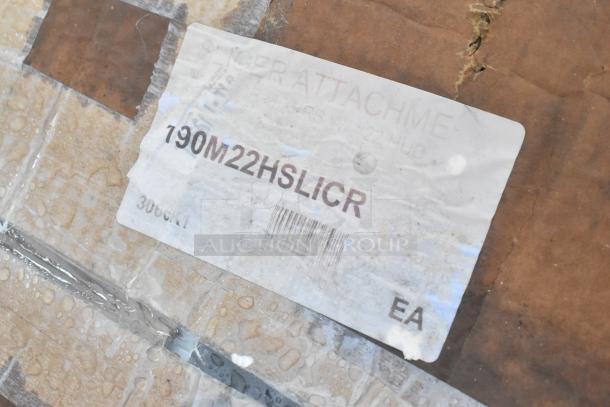 Cardboard packaging with label showing "Slicer Attachment" and model "190M22HSLICR," indicating contents and potential use.