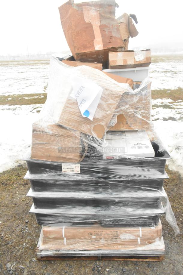 Pallet of 27 new scratch and dent items including plates, hand sink, and mat; wrapped in plastic, various packaging visible.