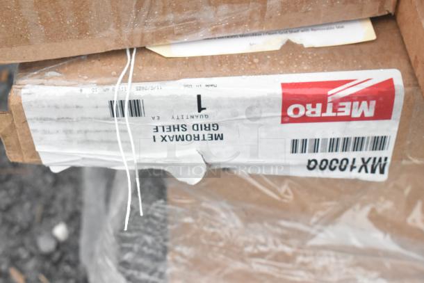 Cardboard box labeled "Metro MX1030GQ Grid Shelf," showing brand new inventory with minor cosmetic issues, wrapped and sealed.