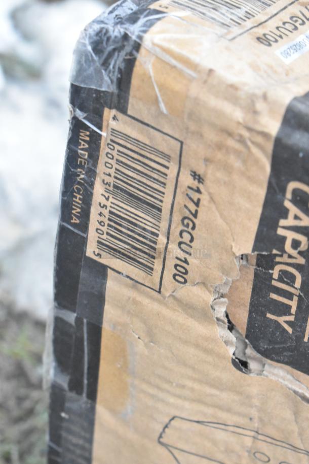 Damaged cardboard box showing the UPC barcode and "Made in China" text, indicating scratch and dent items.