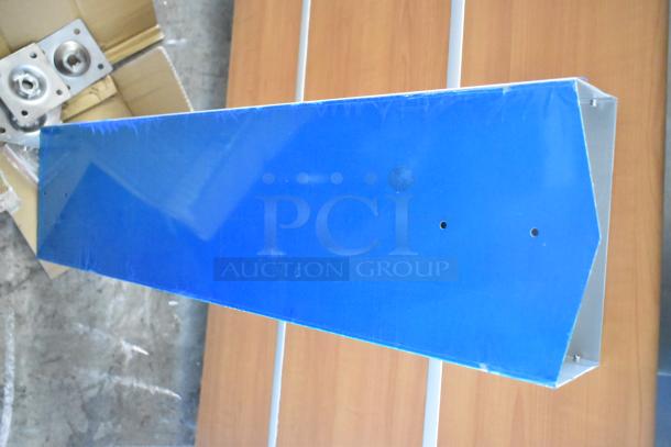 Pallet lot with various items including blue metal piece, receipt printers, and hardware. Visible cardboard packaging.