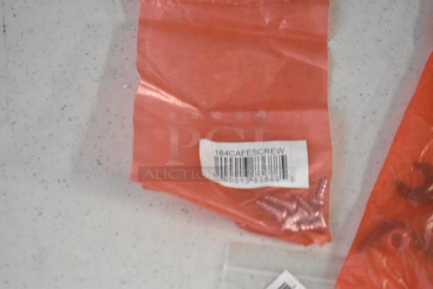Clear plastic bag containing metal screws, labeled "164CAFESCREW" with barcode. Part of mixed pallet lot.