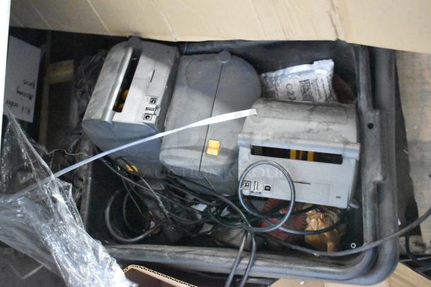 Pallet lot with various items including metal pieces and receipt printers. Items show signs of use; cables and hardware visible.