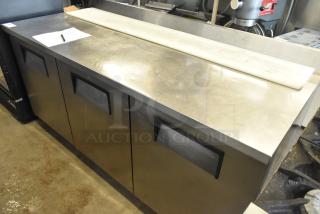 True TWT-72 Commercial 3 Door Work Top Cooler on casters, stainless steel, 115 volts, 1 phase, excellent condition.