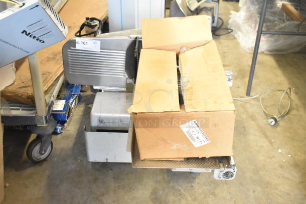 Bizerba commercial countertop meat slicer stacker with box of parts. Includes 115 volts, 1 phase. Visible labels indicate item number 161.