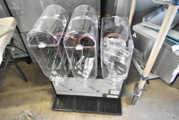 Brand new Narvon 378RBD5G3 triple 5-gallon bowl beverage dispenser, 115V, 1 Phase. Slight scratches, tagged and labeled.