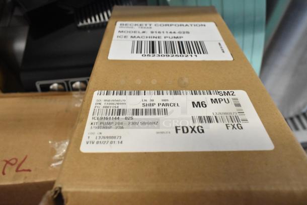 Brand new Ice-O-Matic Kit Pump 458206233602S, 208-230V, 50/60Hz, with visible labels showing model 9161144-02S and specs.