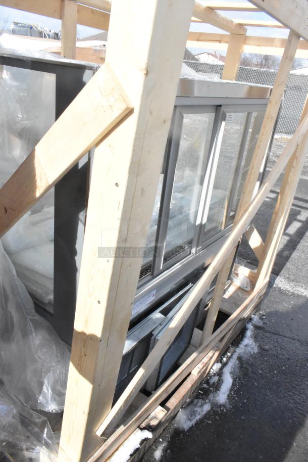 Federal Industries ITR6034 60" refrigerated bakery display case in wooden crate, showing broken glass; new scratch and dent condition.