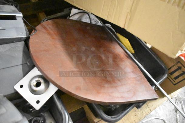 14 mixed items including receipt printers, hardware, and wooden legs. Items show signs of use, bundled on a wooden pallet.