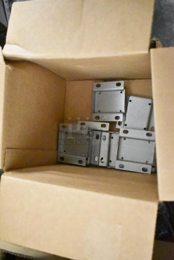 Box containing various hardware components, including metal brackets, auction lot of 14 items, good condition.