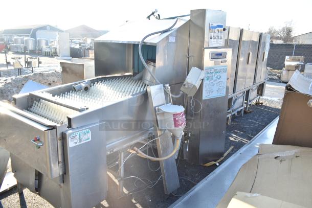 Hobart FT900 commercial flight type dishwasher, 480V, 3-phase, stainless steel exterior. Features operational controls and wash labeling.