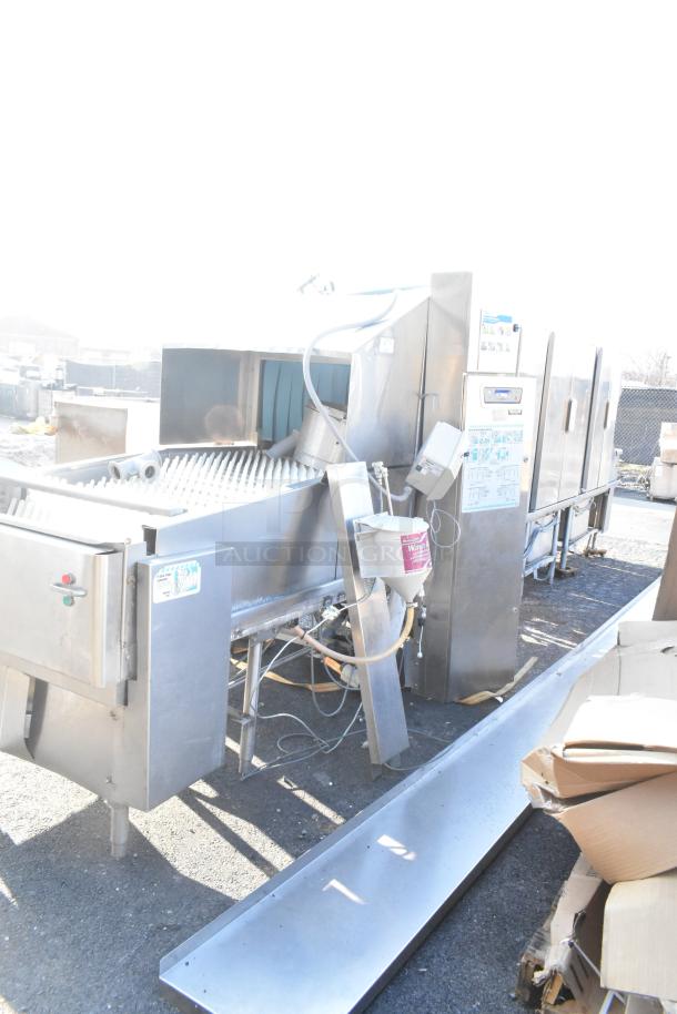 Hobart FT900 commercial flight type dishwasher, stainless steel, 480 volts, 3 phase, visible controls and connectors, used condition.