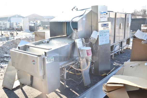 Hobart FT900 commercial flight type dishwasher, 480V, 3-phase. Stainless steel, exterior controls, used condition.