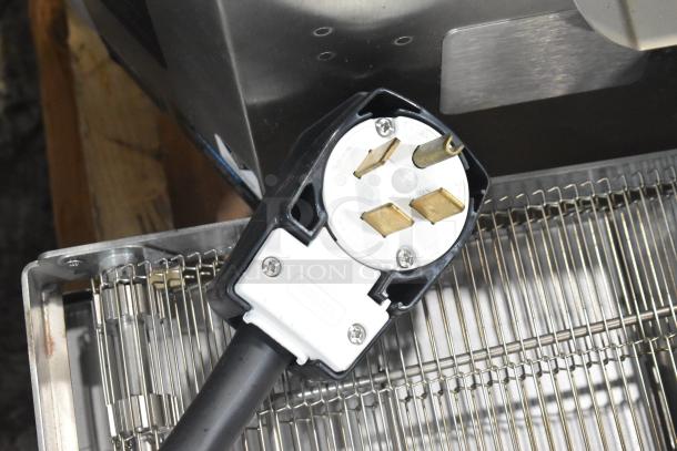 Turbochef HhC2020 conveyor oven plug and metal rack visible, showcasing the commercial electric oven's quality build.