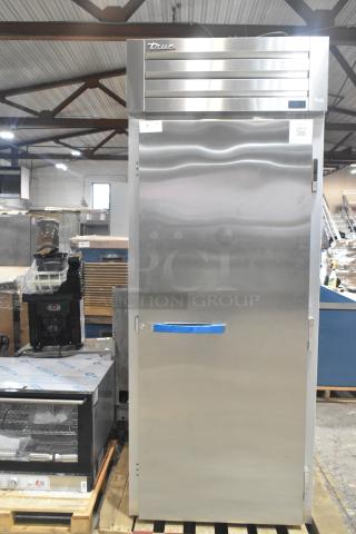 Brand new True STG1RRI89-1S-HC single door roll-in rack cooler, stainless steel, 120V, with minor scratches.